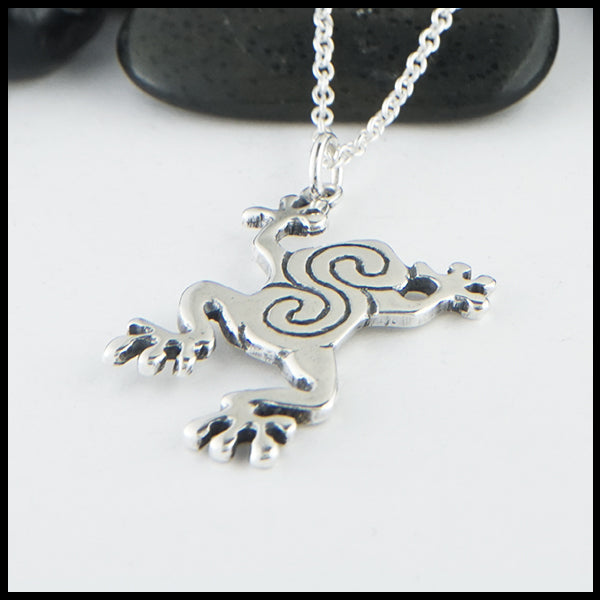 Profile view of Celtic frog pendant in sterling silver.