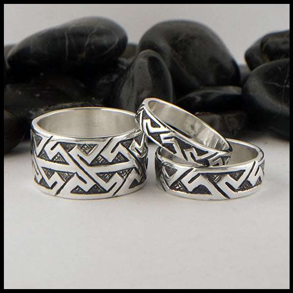 Three variations of key pattern ring