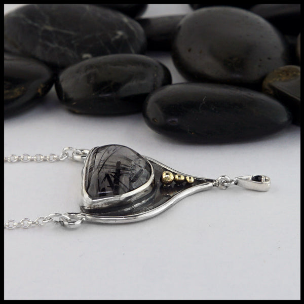 rutilated quartz pendant with black sapphire 