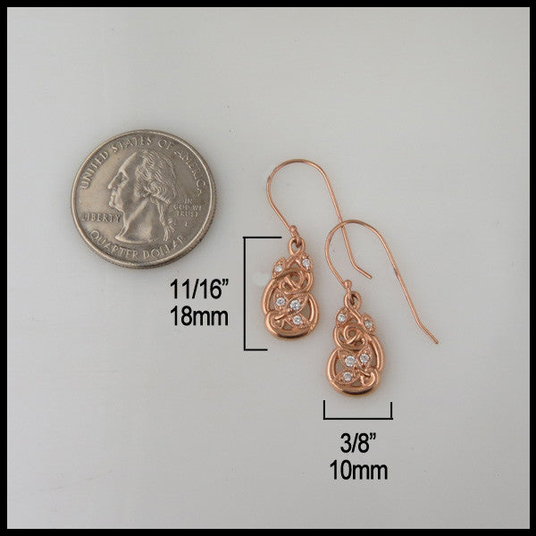 Earrings measure 11/16" by 3/8"