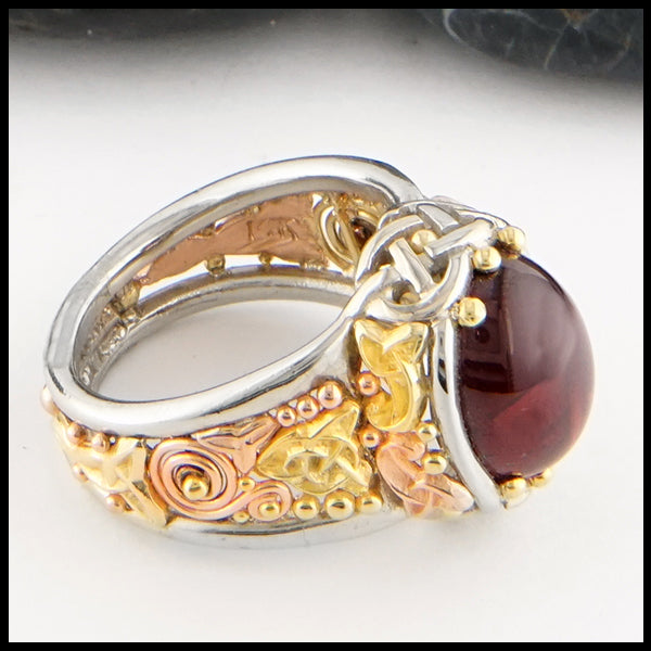 Garnet Cathedral ring in yellow, rose, and white gold