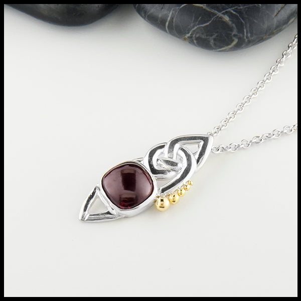 Profile view Celtic Pendant with Cabochon Garnet