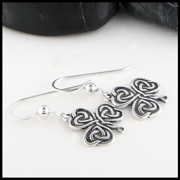 Overhead view of Heart Shaped Shamrock Drop Earrings