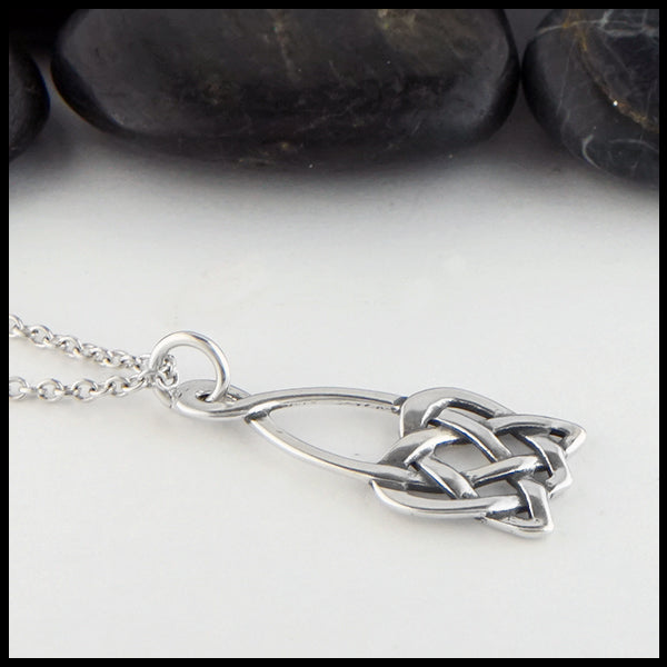 Profile view open heart knot pendant