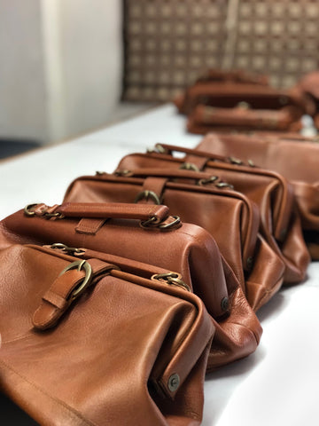 leather trim for handbag, materials on a table, the joan crossbody bag.