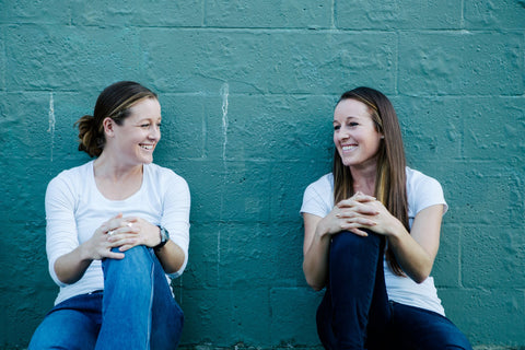 Two triathletes sitting down