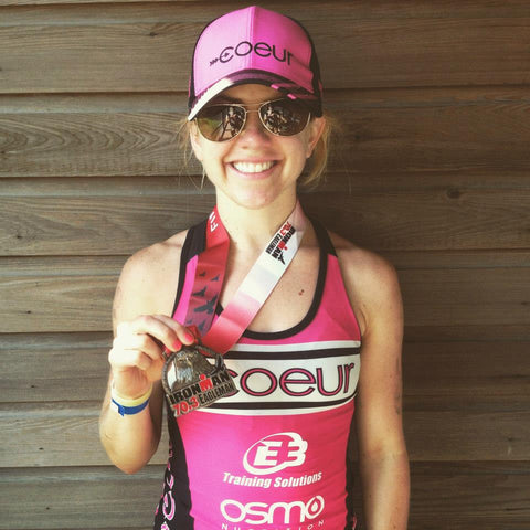 Kristin with Ironman medal