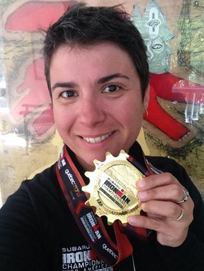 Female with triathlon medal