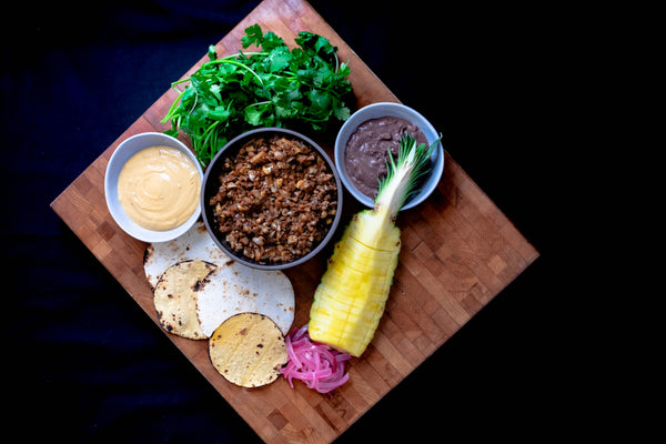 Sautéed Cauliflower and Walnut "Taco Meat", black beans, tortillas, pineapple, cilantro