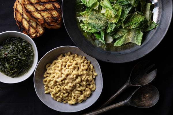 Howl Classic Mac & Chef, braised collard greens, grilled bread, romaine salad