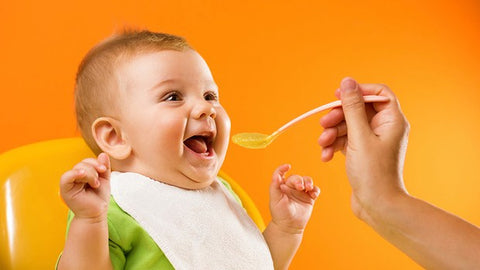 baby eating organic food