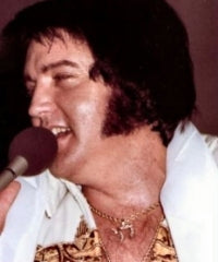 Elvis wearing a chai pendant