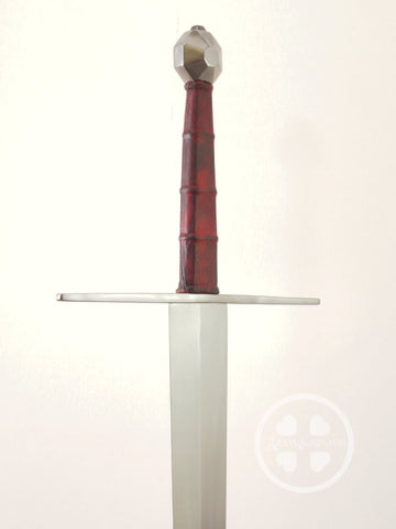 Large XVIIIc long sword with dark red ribbed grip and octagon pommel.