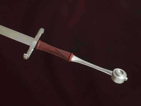 Sword with upper grip as shaped part of tang.