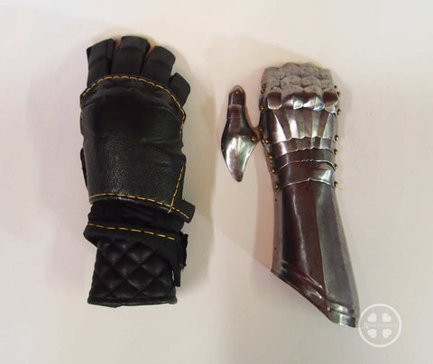 Modern gauntlet side by side with medieval gauntlet for size comparison.