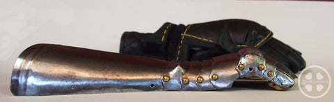 side view of medieval gauntlet in front of modern fencing gauntlet