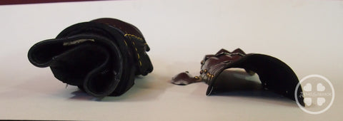 Modern gauntlet side by side with medieval gauntlet for size comparison viewed from the vambrace end.