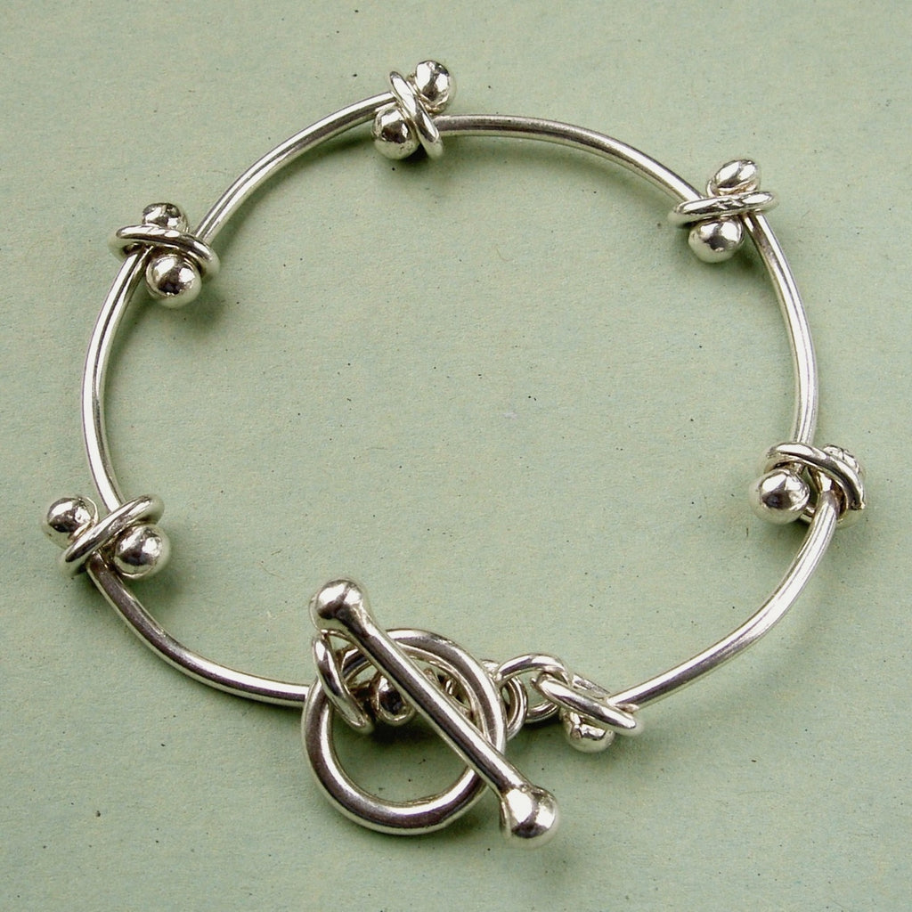 Home  Products  Vintage, sterling silver curve-linked bracelet