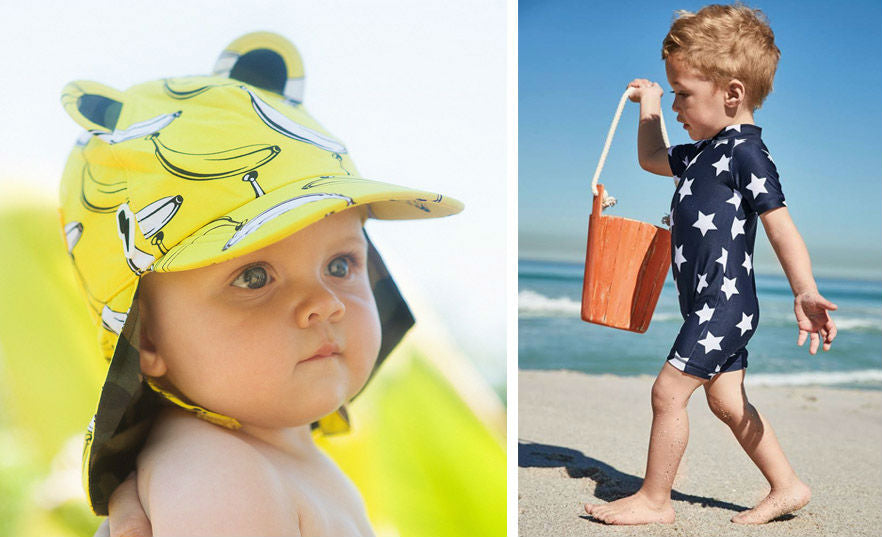 Baby in sun hat and sun protection suit