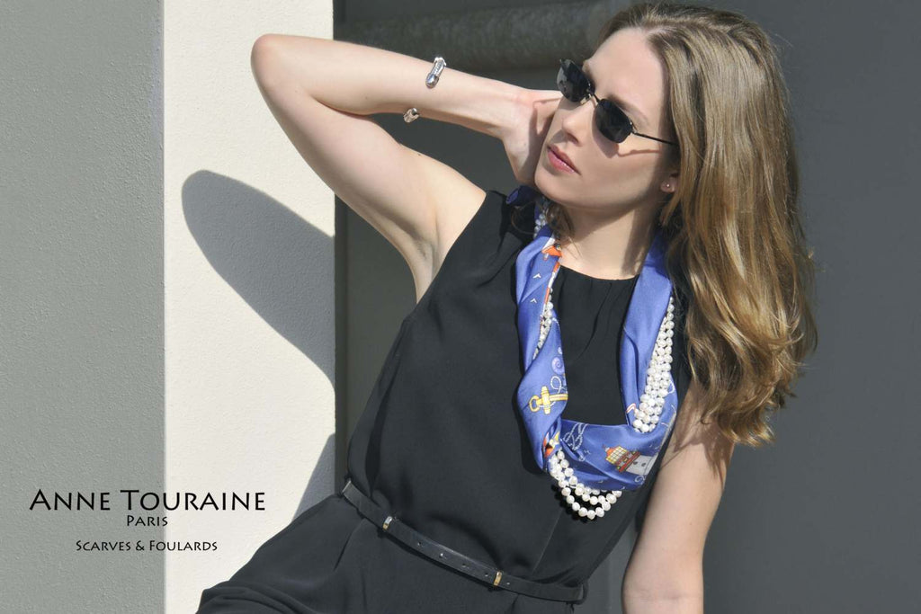 French silk scarves by ANNE TOURAINE Paris™: Nautical blue scarf intertwined with a long pearl necklace