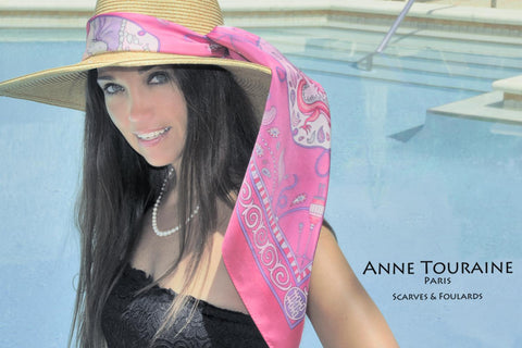 Fuschia silk scarf by ANNE TOURAINE Paris™ around a straw hat: a summer must-have