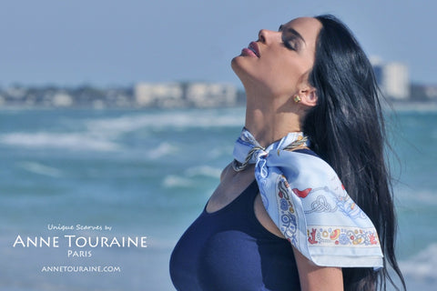 Blue Nautical silk scarf by ANNE TOURAINE Paris™ as a neckscarf intertwined with a silver necklace 