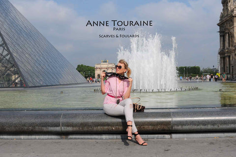 Elegant and stylish French woman wearing the ANNE TOURAINE Paris™ astrology black silk scarf