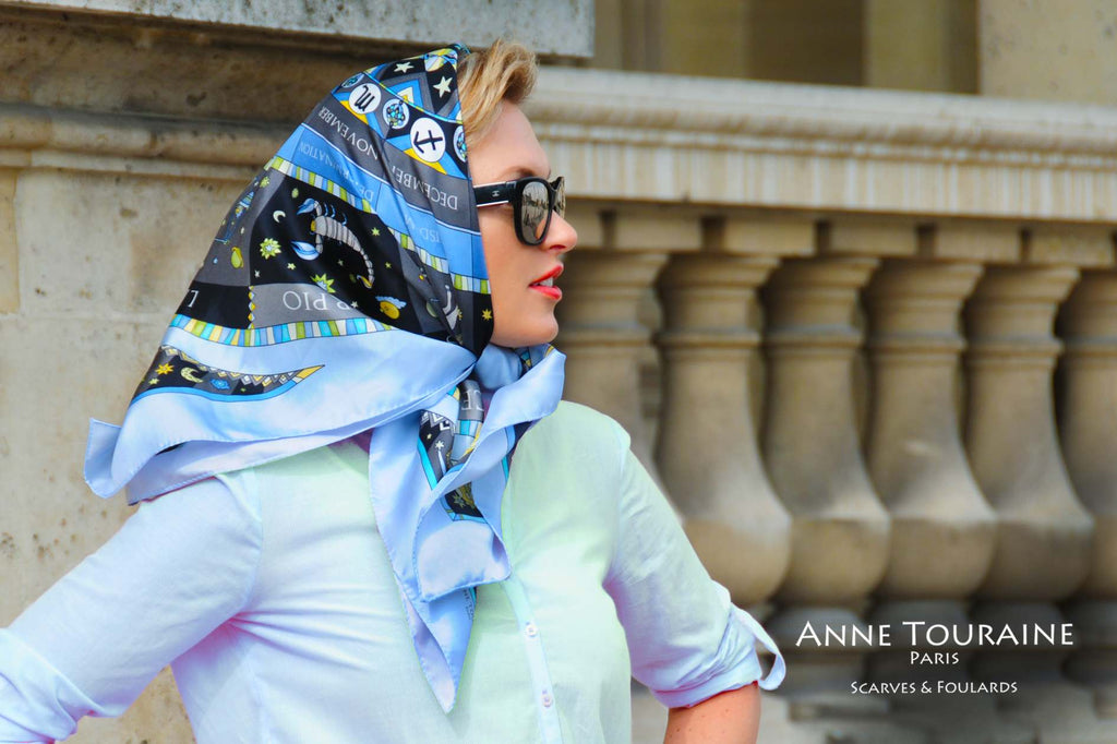 French silk scarves, Astrology and Zodiac design in blue color, by ANNE TOURAINE Paris™, tied as a head scarf a la Jackie Kennedy