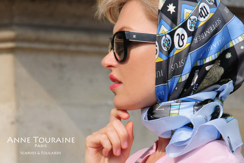 Zodiac and astrology inspired blue silk scarf by ANNE TOURAINE Paris™ tied a la Grace Kelly headscarf