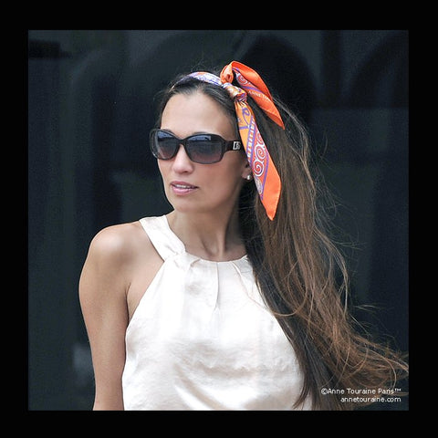 Orange scarf by ANNE TOURAINE Paris™ tied as a headband 