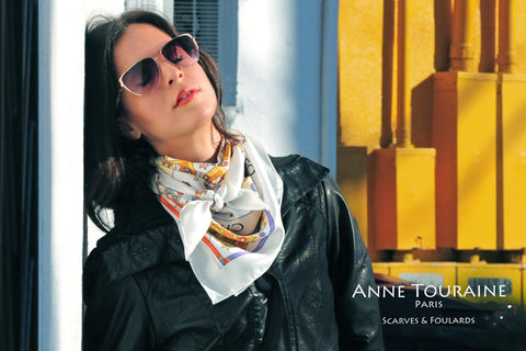 French silk scarves by ANNE TOURAINE Paris™: white astrology inspired scarf tied around the neck
