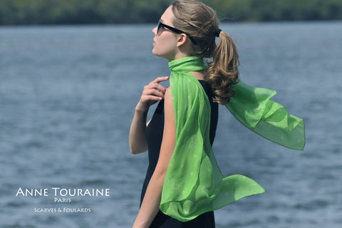 Green scarf by ANNE TOURAINE Paris™ with dog pattern, green color, tied in a romantic style