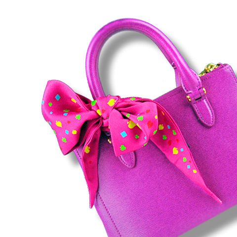 twillies by ANNE TOURAINE Paris™; pink twilly tied on a pink handbag