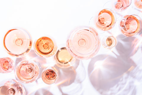 Many glasses of rose wine from above