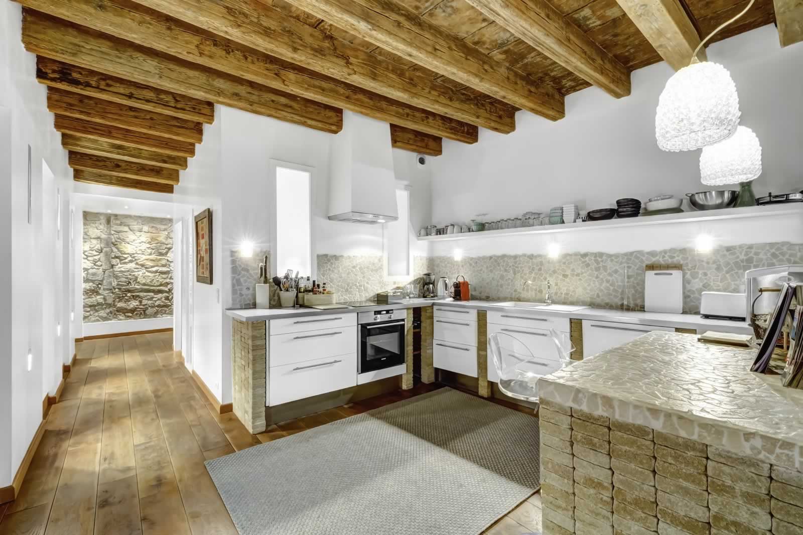 Loving the mix of old and new, the fabulous beams, the stone wall and open kitchen. Listing from Barnes International.