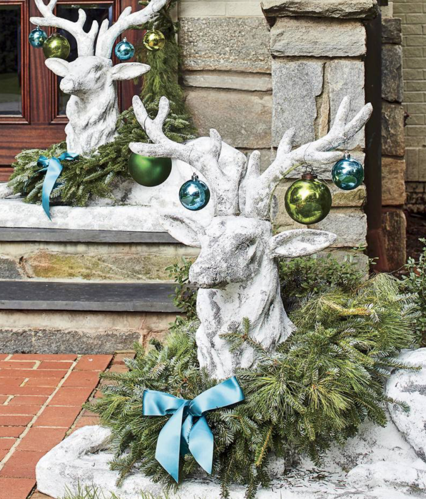 Have some fun. Even your stone friends can get dressed up for the holidays. (<a href="https://www.southernliving.com/christmas/decor/fresh-christmas-greenery?slide=561044#561044" target="_blank">Southern Living</a>/Laurey W. Glenn)