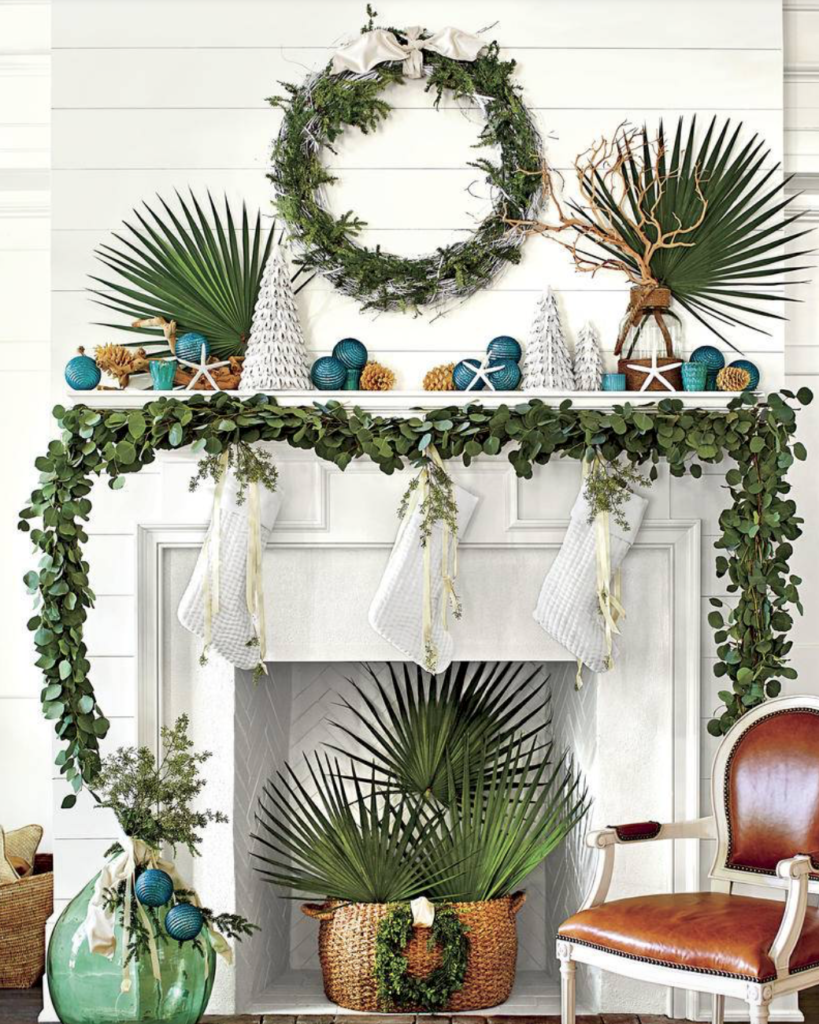 Headed to the beach? Keep the seaside vibe going with palms mixed with your greenery. (<a href="https://www.southernliving.com/christmas/decor/fresh-christmas-greenery?slide=561044#561044" target="_blank">Southern Living</a>/Laurey Glenn)