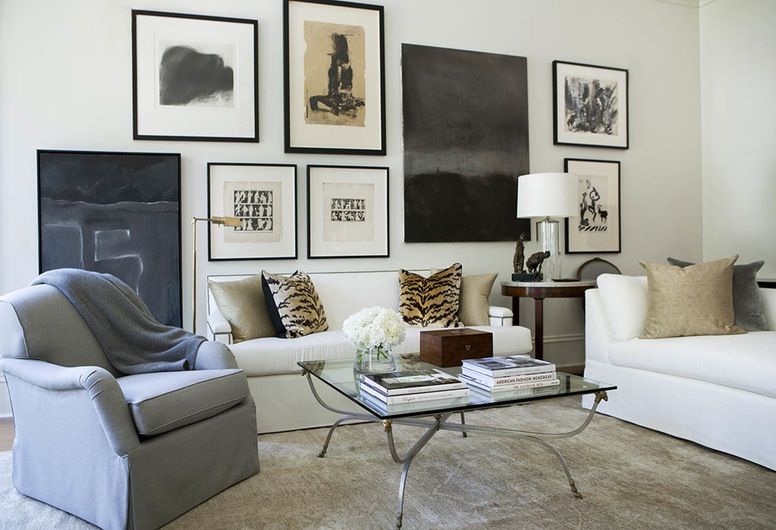 We love the collected feel of this art wall by designer Robert Brown, showing a range of styles unified by similar colors