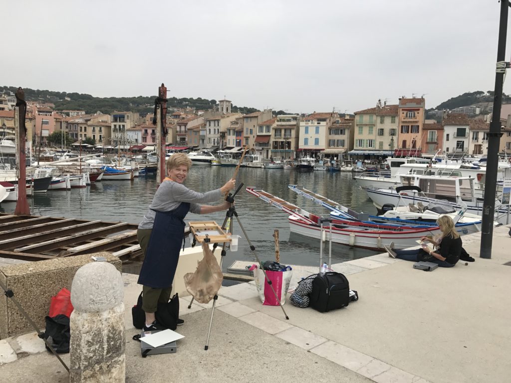 Setting up easels in the charming port of Cassis