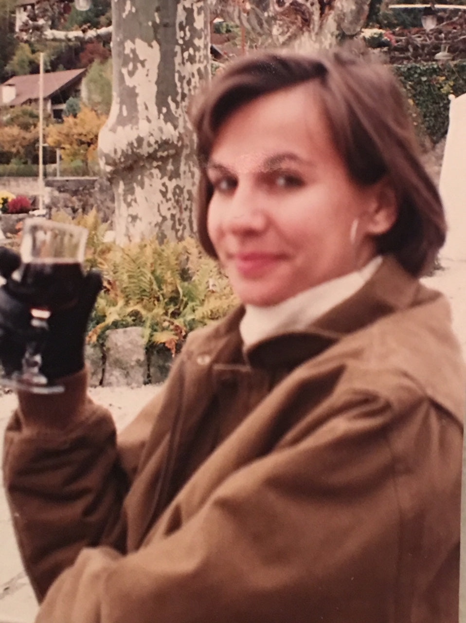 Miss Meggie, sampling the wine, at the Abbaye in Talloires.