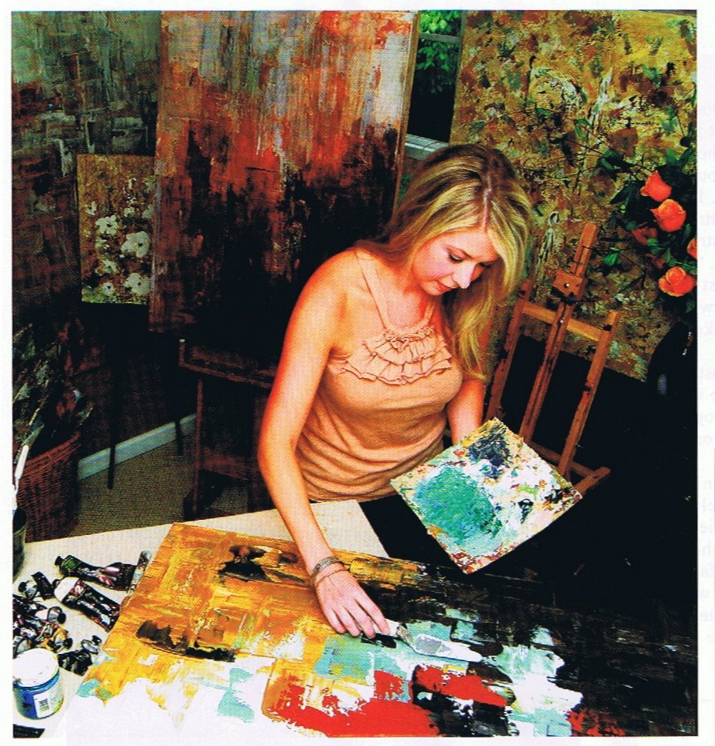 Melissa painting in her studio (from Cobb Life)