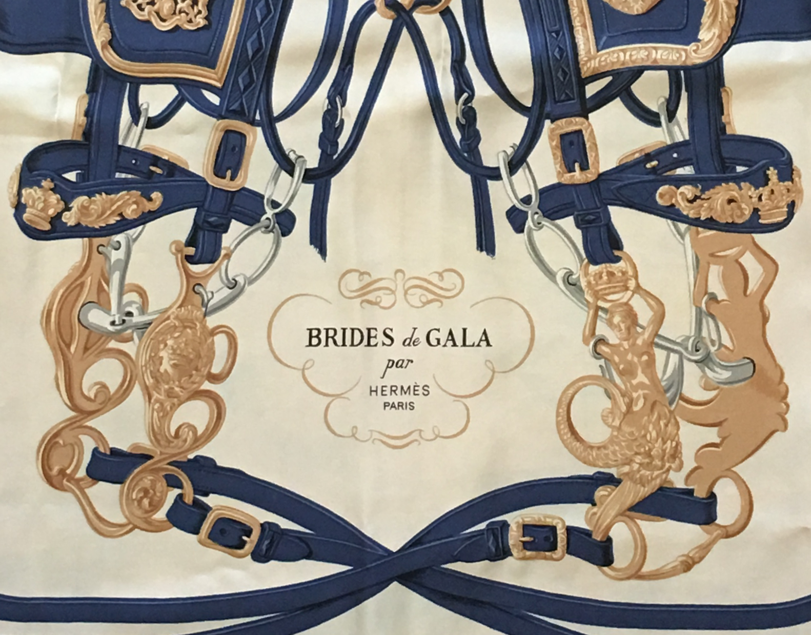 <a target="_blank" href="https://huffharrington.com/collections/accessories/products/vintage-hermes-scarf-brides-de-gala">Brides de Gala</a>, issued in 1957, was designed by Hugo Grygkar and is Hermès’s best-selling design of all time.