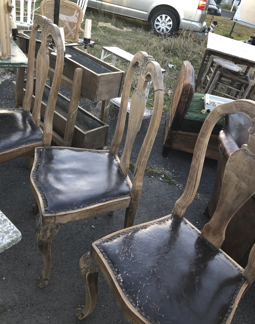 Stripped oak Queen Anne style old and crackly leather chairs. We have six.