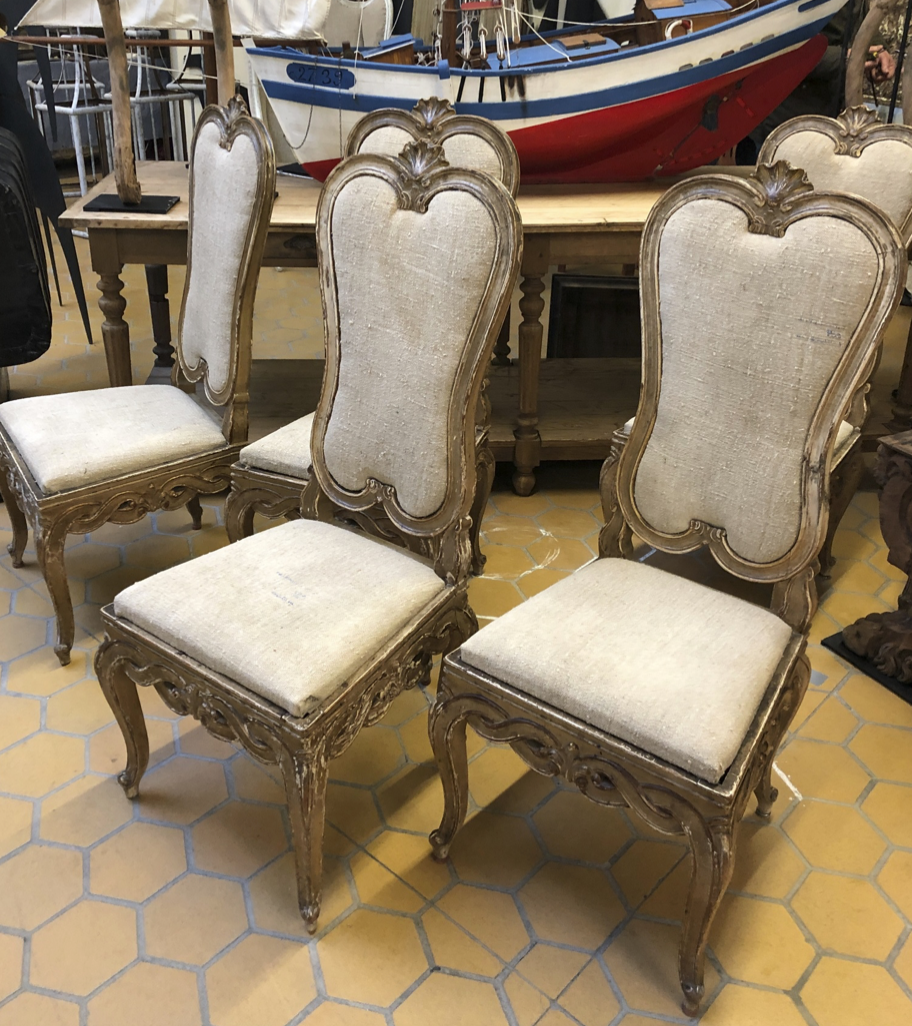 We fell in love with these carved, stripped Italian chairs with nubbly linen and curvy lines. We have 6.