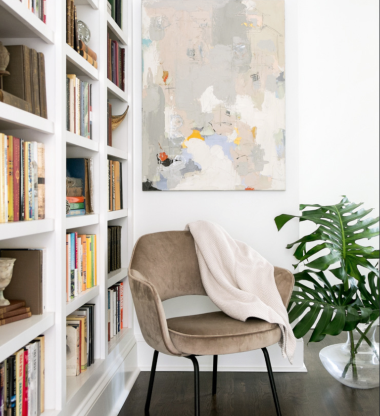 A Danish mid-century chair from France looks perfect with an abstract from <a href="https://huffharrington.com/collections/andrea-costa" target="_blank">Andrea Costa</a>.