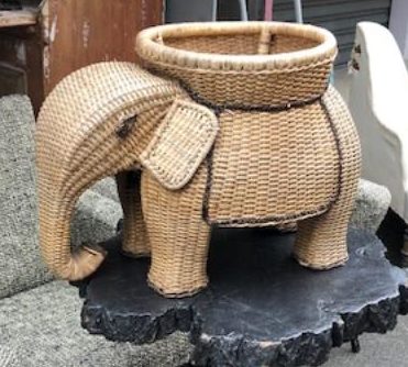 A perfectly sophisticated little wicker elephant side table.