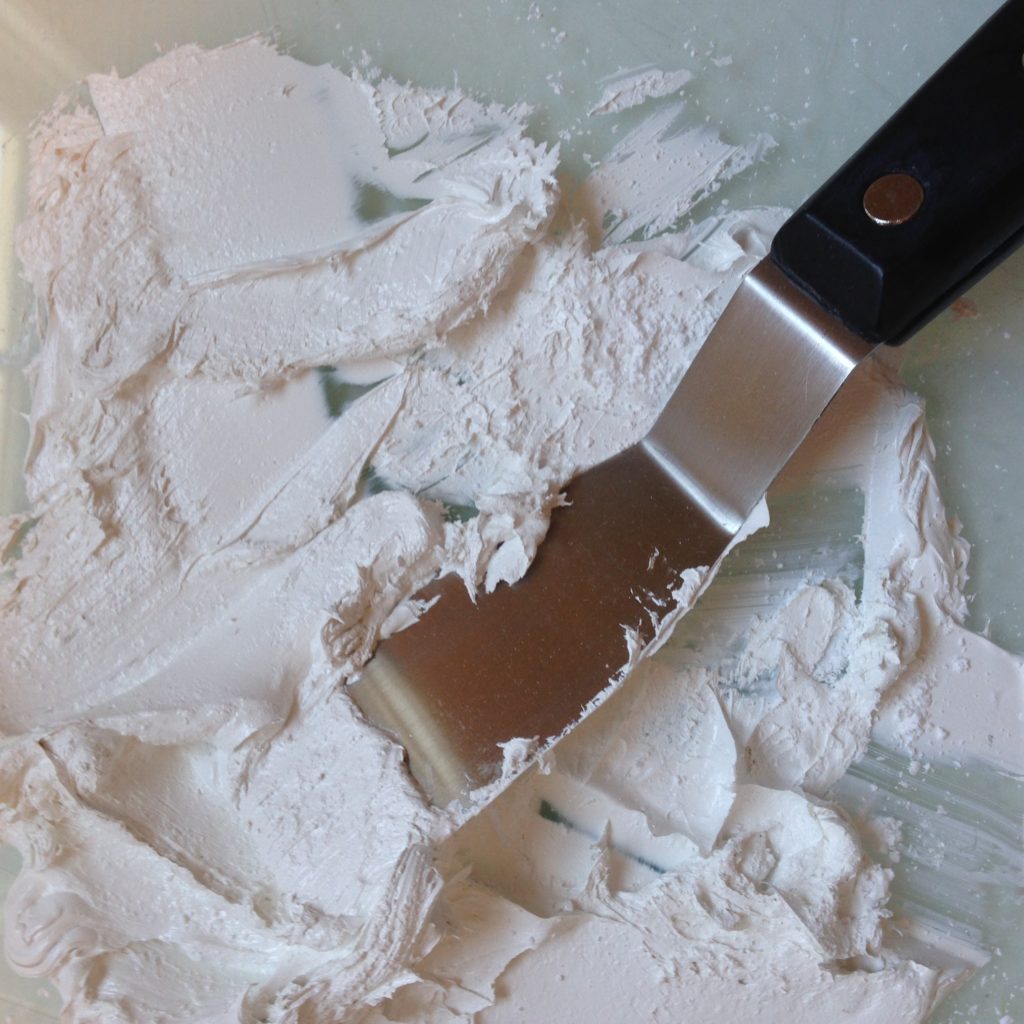 The artist's favorite painting weapon, the palette knife, and the texture that is reminiscent to textile design