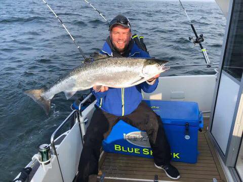Anni fishing the Baltic with a blue 125 Quart Icey Tek Ice Chest Cooler