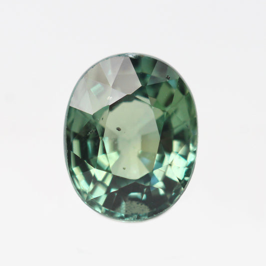 1.55 Carat Light Teal Green Oval Madagascar Sapphire for Custom Work - Inventory Code TGOS155 - Midwinter Co. Alternative Bridal Rings and Modern Fine Jewelry