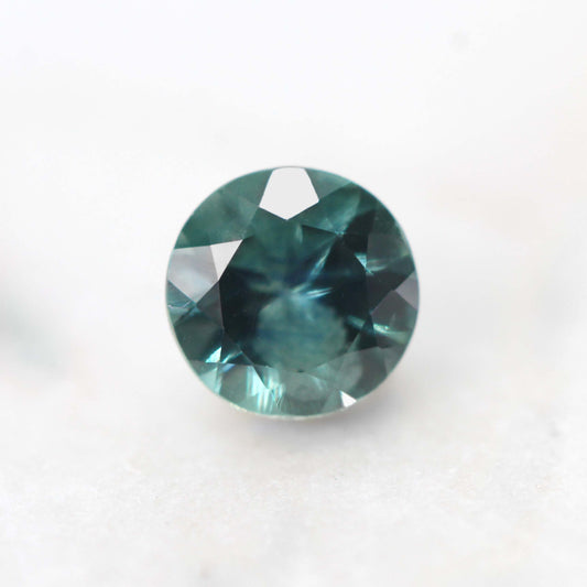 5mm Round Teal Montana Sapphire for Custom Work - Inventory Code TRMS057 - Midwinter Co. Alternative Bridal Rings and Modern Fine Jewelry